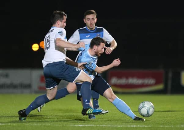 Ballymena's Willie Faulkner in action with Ards Gareth Tommons on Tuesday. Pic: Presseye