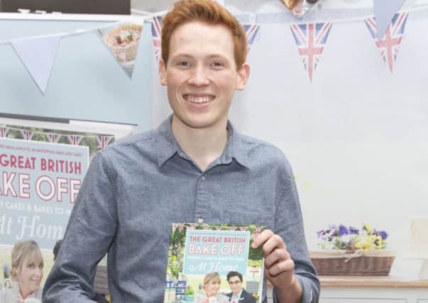 Andrew Smyth, a finalist in this year's The Great British Bake Off, signed copies of the TV tie-in recipe book at Waterstones in Piccadilly, London