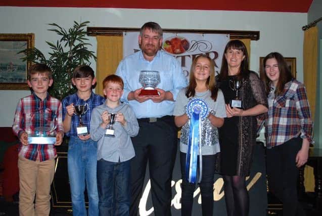 The Tumelty family of Castlesceen Herd with their cups and the Rose Bowl won at RBST NI Gosford.