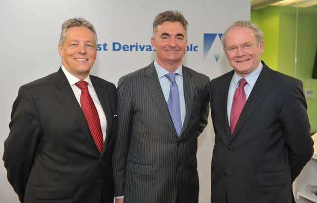 First Derivatives founder and chief executive Brian Conlon pictured, centre, with former First Minister Peter Robinson and Deputy First Minister Martin McGuinness