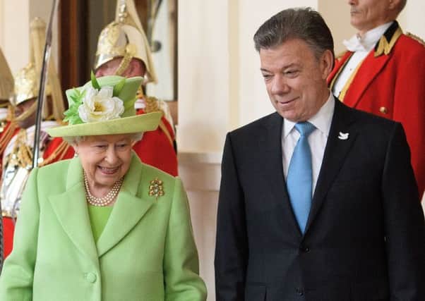 The Queen with Juan Manuel Santos after his arrival in London