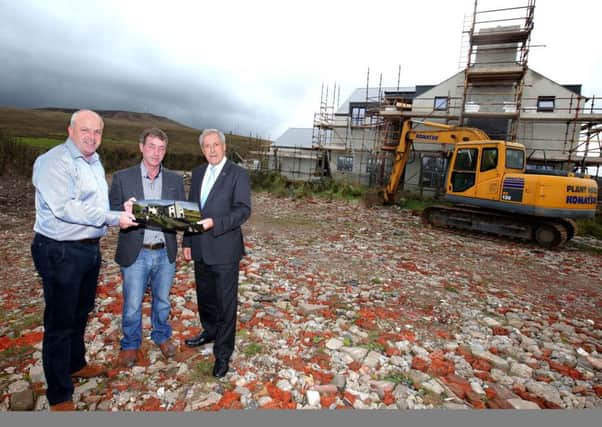 Pictured on site at the construction of the stunning Â£1.75 million Standing Stones development are: (l-r) Alderman James Tinsley; Paul McLarnon, owner of the development; and Councillor Uel Mackin, Chairman of the Council's Development Committee.
