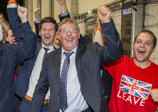 DUP MLA Sammy Wilson celebrates with Leave supporters at the Titanic Exhibition Centre, Belfast, the night that the Leave campaign claimed victory in the EU referendum. Photo: Liam McBurney/PA Wire