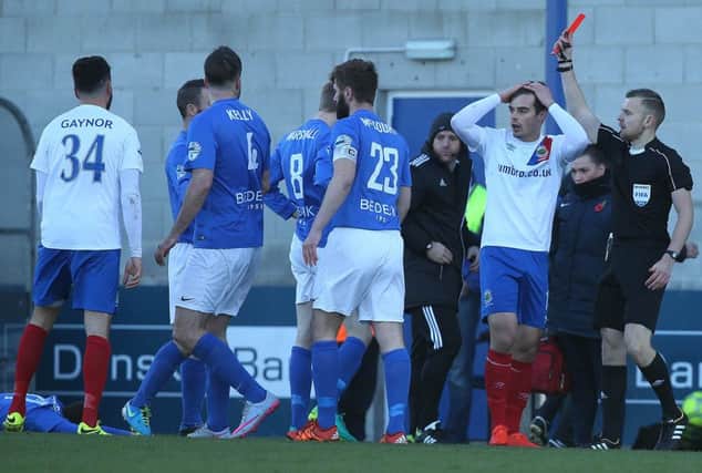 Referee Tim Marshall shows a red card to  Linfield's  Matthew Clarke against Glenavon during Saturday's Danske Bank Premiership match at Mourneview Park. (Picture by Brian Little/Press Eye)