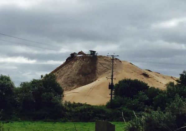 Mounds of sand extracted from Lough Neagh at Toome