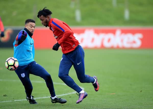 England's Nathaniel Chalobah (right) and Jesse Lingard (left) during a training session at St George's Park, Burton