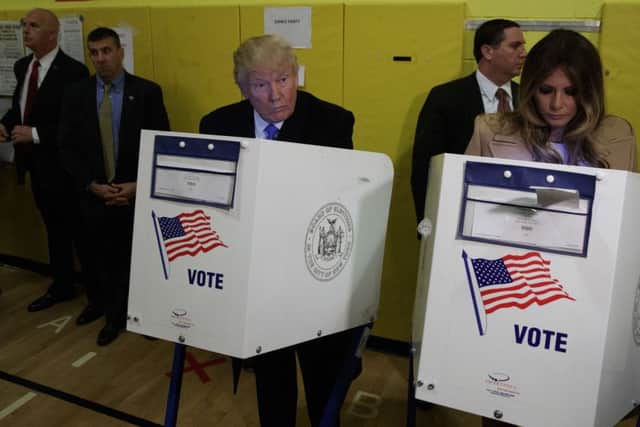 Republican presidential candidate Donald Trump, and his wife Melania, casts their ballots at PS-59, Tuesday, Nov. 8, 2016