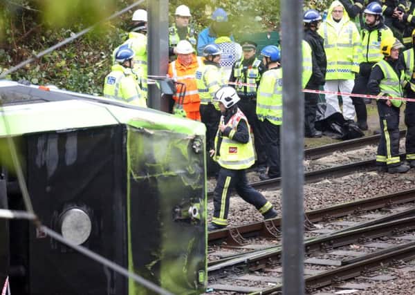 The scene after a tram overturned in Croydon, south London, trapping five people and injuring another 40.  Photo credit : Steve Parsons/PA Wire