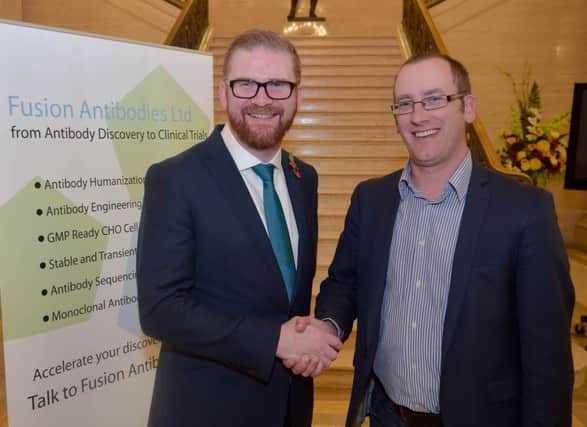 Economy Minister Simon Hamilton pictured with Fusion MD Dr Paul Kerr