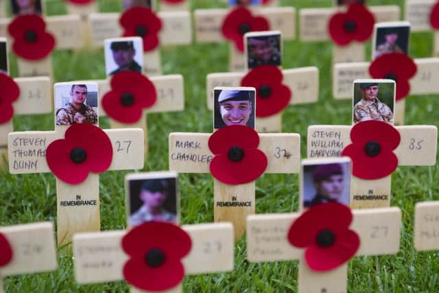 Silence fell at 11:00 GMT to remember servicemen and women killed in battle. A service of rememberance was held at the cenotaph in the grounds of Belfast City Hall to remember those who died giving their lives for their country. Picture Mark Marlow/Pacemaker Press
