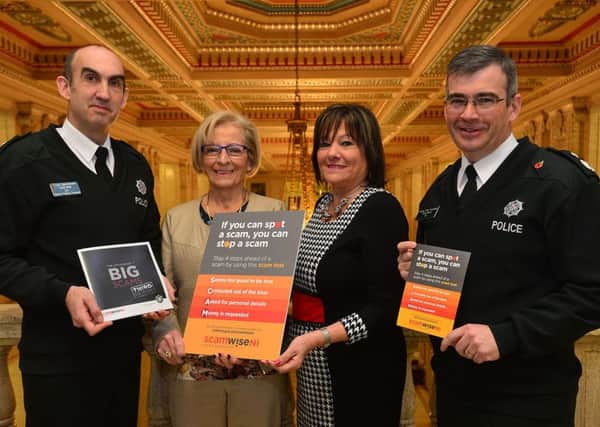 Temporary Chief Superintendent Simon Walls, Erika Murray, who has been a victim of scammers and an advocate for the initiative, Anne Connolly, Chair of The Northern Ireland Policing Board, and Deputy Chief Constable Drew Harris at the launch of ScamwiseNI initiative.