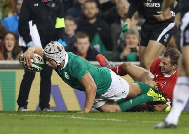 Ireland's Luke Marshall scores a try