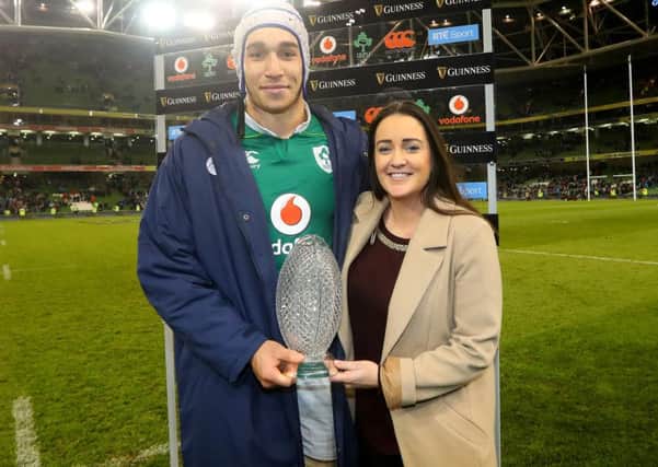 a
Irelands Ultan Dillane presented with the man of the match award by Gemma Bell of Guinness