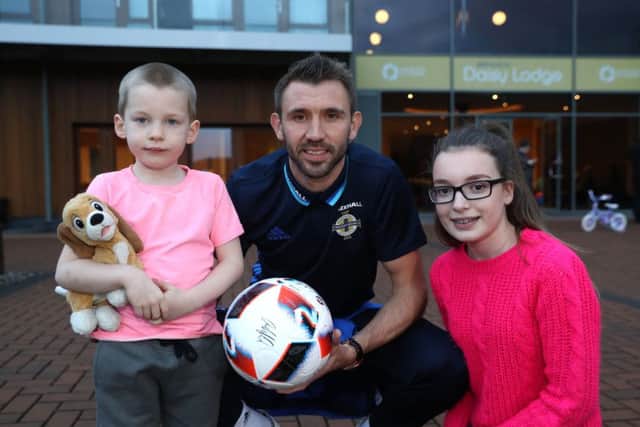 Gareth McAuley meets with Alex and Katie at Daisy Lodge, Cancer Fund for Children's therapeutic short break facility in Newcastle, County Down. Photo by William Cherry