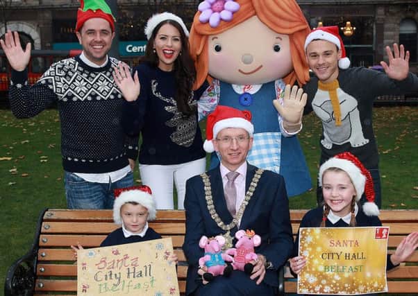 Lord Mayor Brian Kingston is joined by Lily of Lilys Driftwood Bay, the Cool FM breakfast team and Corey Courtney and Lauren Picking from Springfield Primary School at the launch of the Christmas Lights switch-on in Belfast