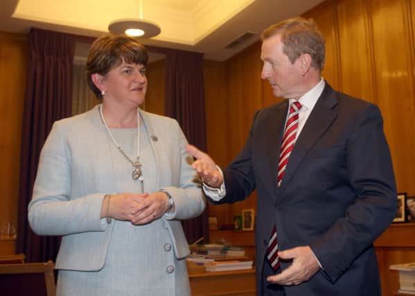 Taoiseach Enda Kenny with Northern Ireland First Minister Arlene Foster. Photo: Brian Lawless/PA Wire
