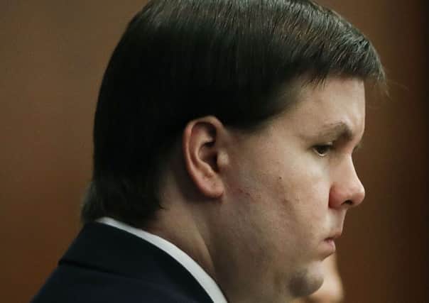 Justin Ross Harris, who is accused of intentionally killing his son in June 2014 by leaving him in the car in suburban Atlanta, stands during his murder trial Monday, Oct. 31, 2016, in Brunswick, Ga. (AP Photo/John Bazemore, Pool)