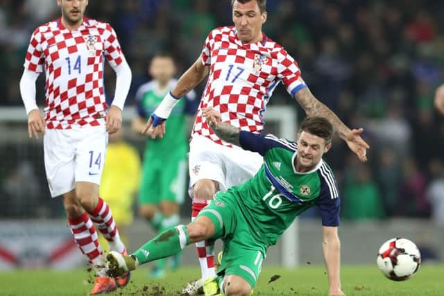 Northern Ireland's Ollie Norwood with Croatia's Mario Mandzukic