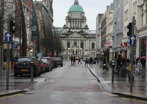 The woman was found dead at a fast food outlet in Donegall Place in Belfast city centre