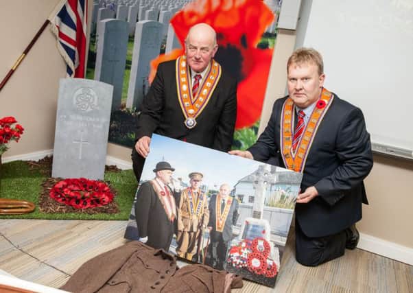 Grand Master of the Grand Orange Lodge of Ireland, Edward Stevenson (left) and Deputy Grand Master Harold Henning showcase one of the photos which will be on display at the Somme 100 exhibition at the Museum of Orange Heritage in Belfast