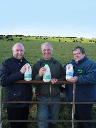 Dale Farm director Jason Hempton, with Dale Farm dairy producer Johnston Morrow and Michael McCallion from Asda.