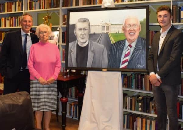 Patrick Greer presents his work With Bold Proclamation to Baroness Paisley and Ian Paisley Junior at an event at the Lord Bannside Library in east Belfast