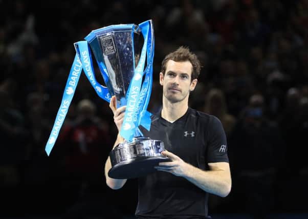 Andy Murray celebrates with the Barclays ATP World Tour Finals at The O2 in London. Pic by PA.
