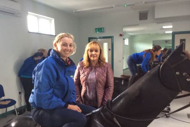 Alice pictured with Agriculture Minister Michelle McIlveen in the racing simulator room during the Ministers recent visit to CAFRE Enniskillen.