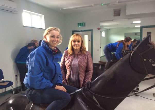 Alice pictured with Agriculture Minister Michelle McIlveen in the racing simulator room during the Ministers recent visit to CAFRE Enniskillen.
