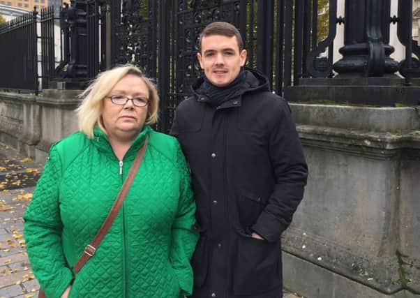 Helen Deery and her son Sean McHugh outside Belfast's Royal Courts of Justice where an inquest hearing for her brother, Manus Deery,  was held