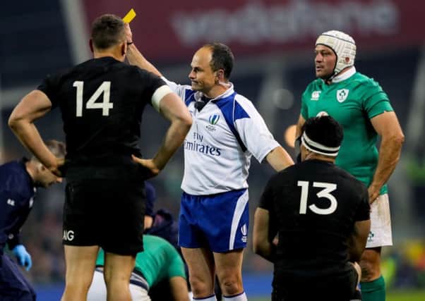 Referee Jaco Peyper shows Malakai Fekitoa of New Zealand a yellow card
 for a high tacle on Zebo panel - a disciplinary panel has now conceded it should have been red