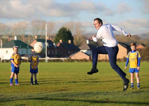 Communities Minister Paul Givan MLA shows off his footballing skills during a visit to St Patricks GAC, Lisburn. Pic by Kelvin Boyes, Press Eye