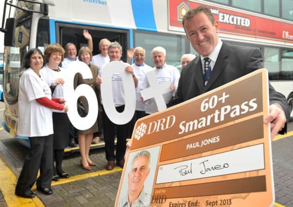 The then transport minister Conor Murphy  in autumn 2008 launches free travel on public transport in NI for people aged 60 to 64, with new passholders in the background.
 Photo by Aaron McCracken/Harrison Photography