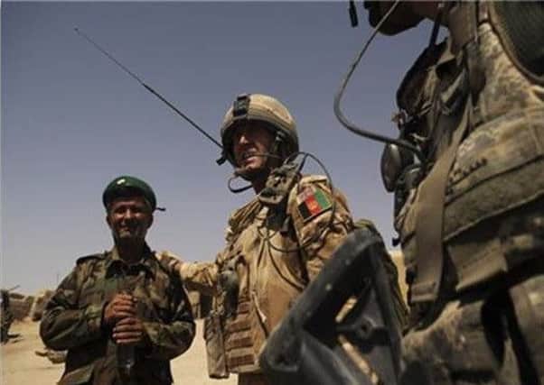 Captain Doug Beattie, now a UUP MLA, pictured with an Afghan commander in Afghanistan.