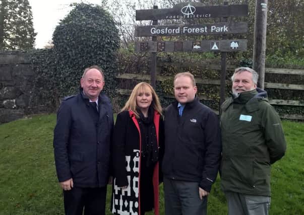 William Irwin MLA, Minister Michelle McIlveen, Coucnillor Gareth Wilson and Forest Service chief executive Malcolm Beatty at the main entrance to Gosford Forest Park