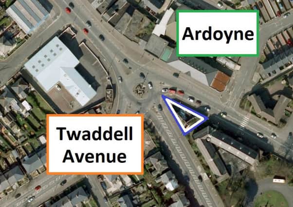 Image of the Twaddell roundabout, north Belfast. The blue marks a suggested spot for a peace memorial, the orange the Protestant side of the interface, and the green the Catholic side. (C) 2016 Infoterra Ltd & Bluesky. Map data (C) 2016 Google