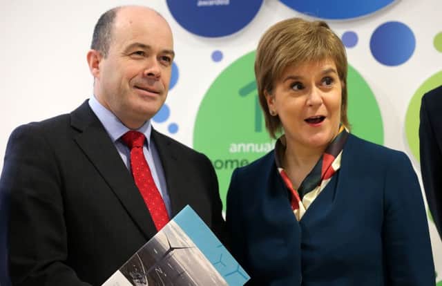 Irish Minister for Communications, Climate Action and Environment Denis Naughten and First Minister of Scotland Nicola Sturgeon pictured with a new sustainability engergy report during a visit to the SSE Ireland headquarters in Leopardstown.