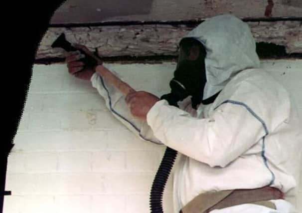 A specialist contractor working to remove asbestos