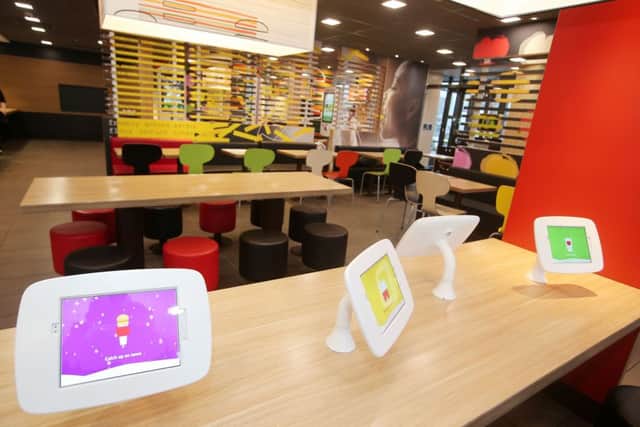 The new-look McDonald's restaurant at Sprucefield has a number of electronic tablets featuring children's games.