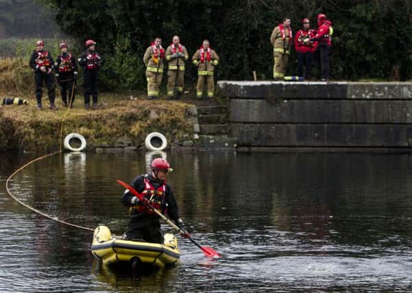 Rescue workers at Victoria Lock on Newry Canal on Sunday as they tried to rescue Connor Galligan