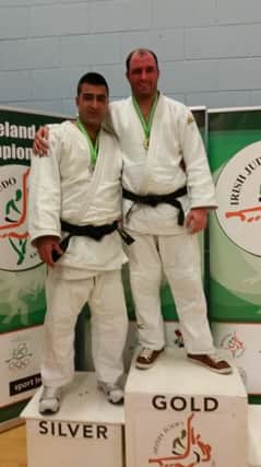 Dungannons All Ireland champion Jonny Herron (right) who beat Najafi Morteza in the final of the over 100 kilos in Dublin
