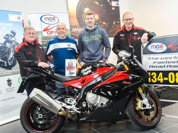 Ian Hutchinson pictured with Eddie Johnston, Dundrod & District Motorcycle Club, Andy Higgins, event compere, and Ken Stewart, Dundrod & District Motorcycle Club at the exclusive Northern Ireland launch of his new book, 'Miracle Man', in Belfast.