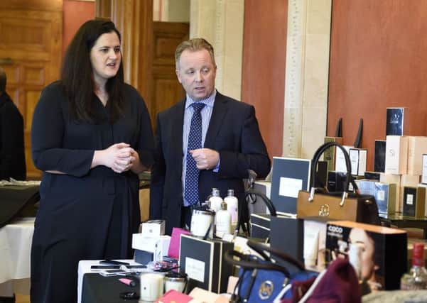 Justice Minister Claire Sugden pictured with Gary Reid, PSNI D/Superintendent viewing counterfeit goods at the launch of the NI Executive advertising campaign which is part of the action plan on tackling paramilitary activity.  Picture: Michael Cooper