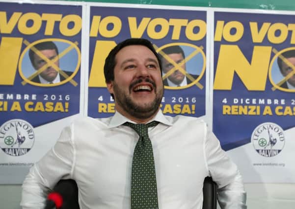 Northern League's leader Matteo Salvini smiles while waiting for the outcome of a constitutional referendum in Milan, Italy, Monday Dec 5. Italians voted in a referendum on reforms that Premier Matteo Renzi has staked his political future on. Renzi conceded defeat and said he will resign. Salvini's Northern League had opposed the reforms. (AP Photo/Antonio Calanni)