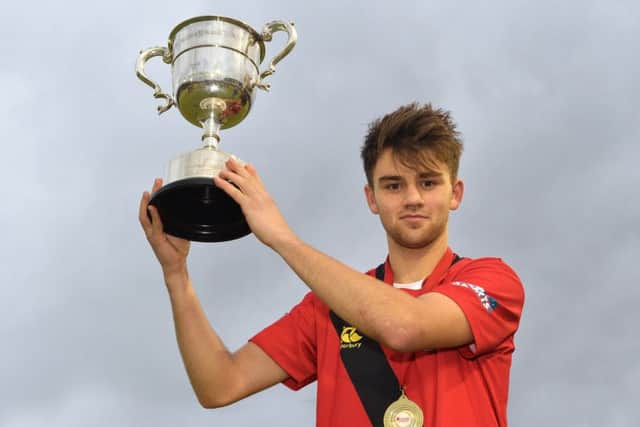 Kyle Marshall collected the trophy after a top display in defence. Pics: Rowland White / Presseye