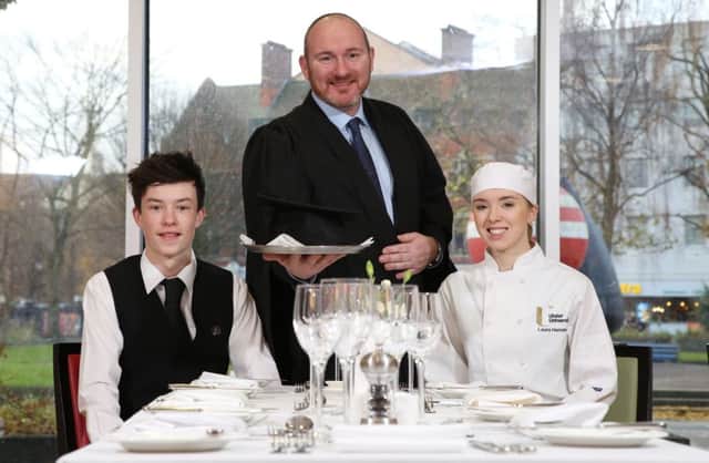 Professor Nial McKenna pictured in The Academy, the University of Ulsters teaching restaurant with students Callum Irwin and Laura Henning
