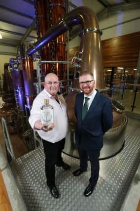 Echlinville founder Shane Braniff introduces Economy Minister Simon Hamilton to the distillerys new gin