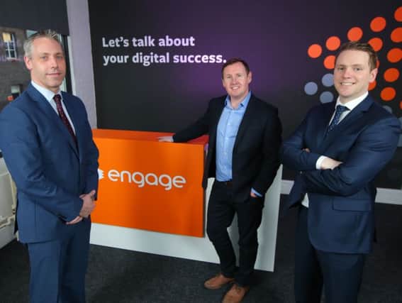 Engage managing director Steven Cassin, centre, with David Ramsey, Bank of Ireland UK, left, and Gavin Kennedy, Bank of Ireland UK