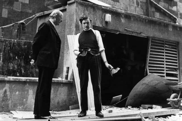 Canon Edgar Turner and Bishop Arthur Butler survey bomb damage at St George's Church in central Belfast, 1973. The church was damaged many times in bomb blasts