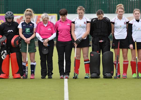 Ulster Premier League
Teams: Queen's (blue) v Raphoe (white) 
Venue: The Dub
Date: 10th December 2016
Caption: Umpires, teams and their officials held a one minute silence at the start of the game in memory of Austin Hunter